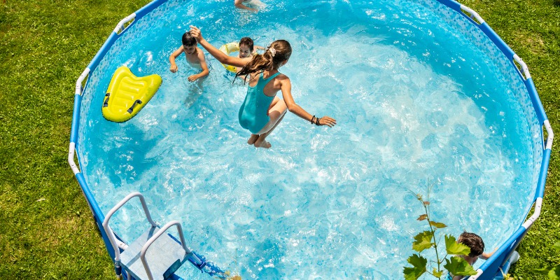 kids playing in an aboveground pool