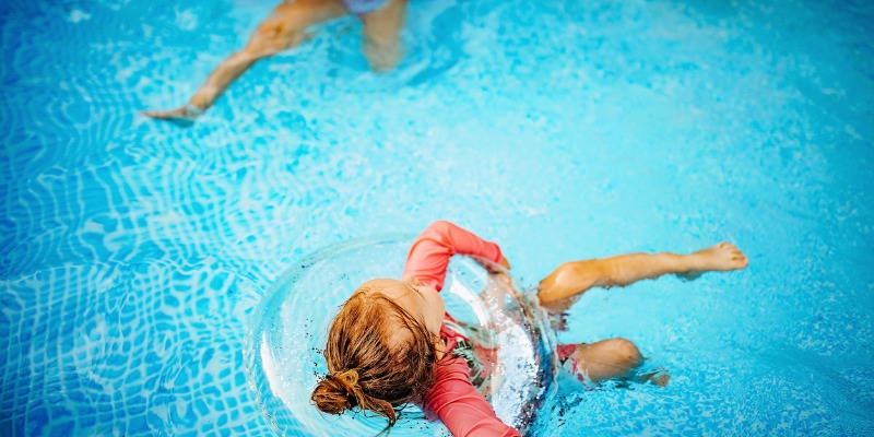 little girl playing in the pool