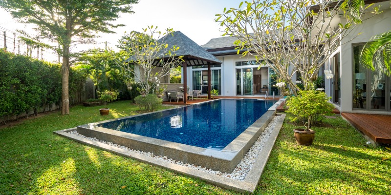 Well manicured swimming pool and deck area