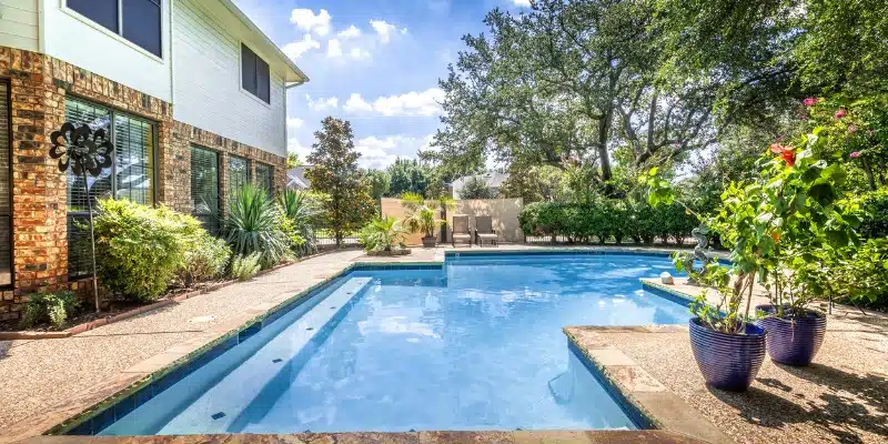 Backyard oasis with swimming pool in a house